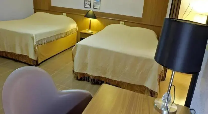 Bed in Numsin Hotel Bed in Numsin Hotel