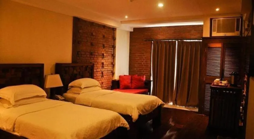 Bed in Mango Valley Hotel