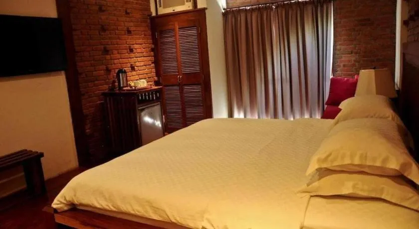 Bed in Mango Valley Hotel