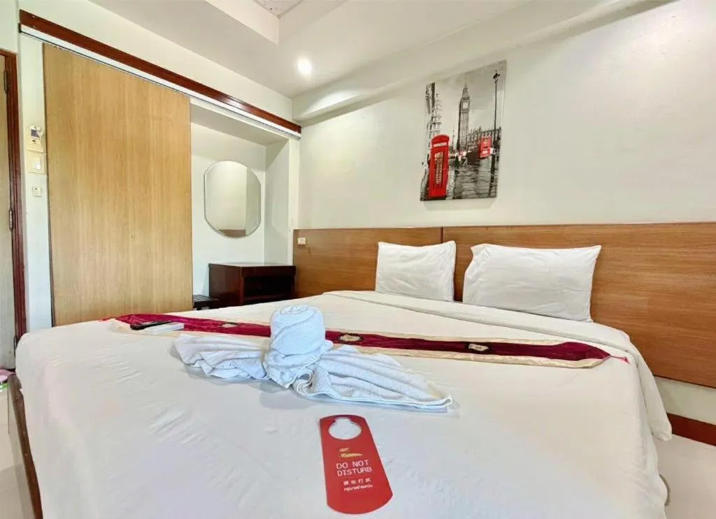 Bed in Century Grand Hotel