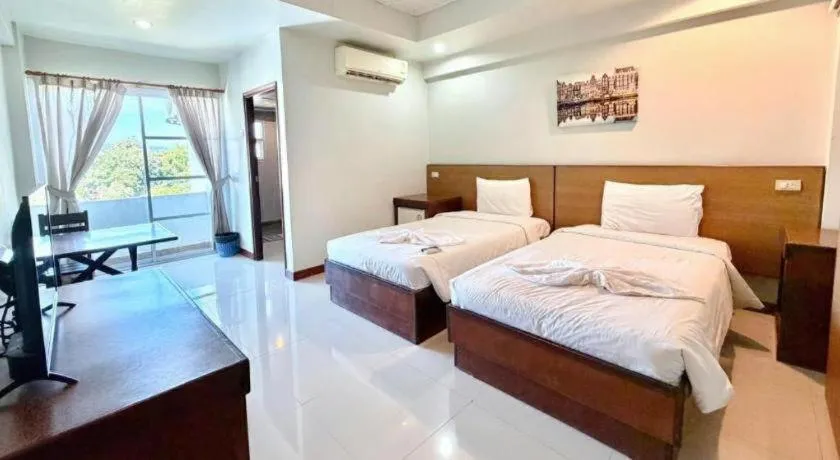 Bed in Century Grand Hotel