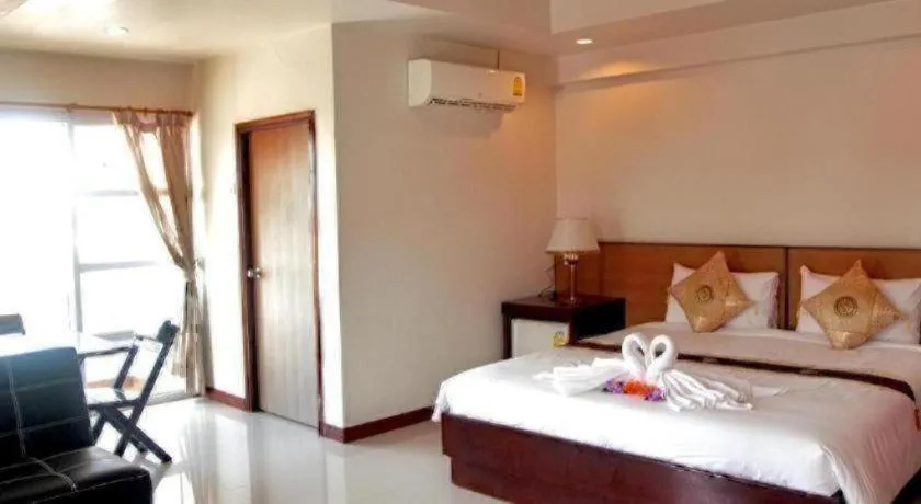 Bed in Century Grand Hotel