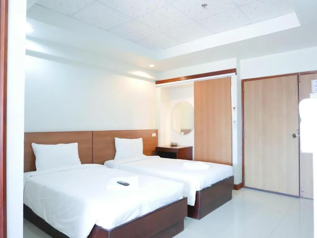 Bed in Century Grand Hotel