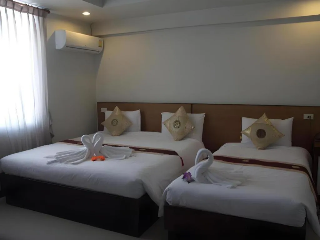 Bed in Century Grand Hotel