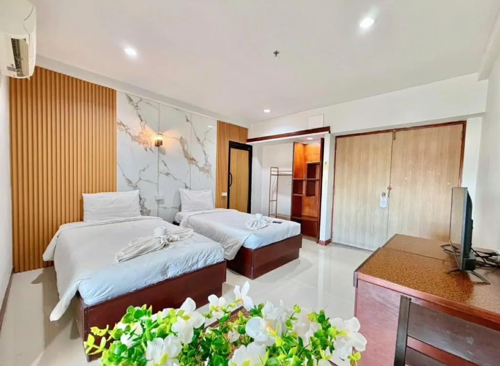 Bed in Century Grand Hotel