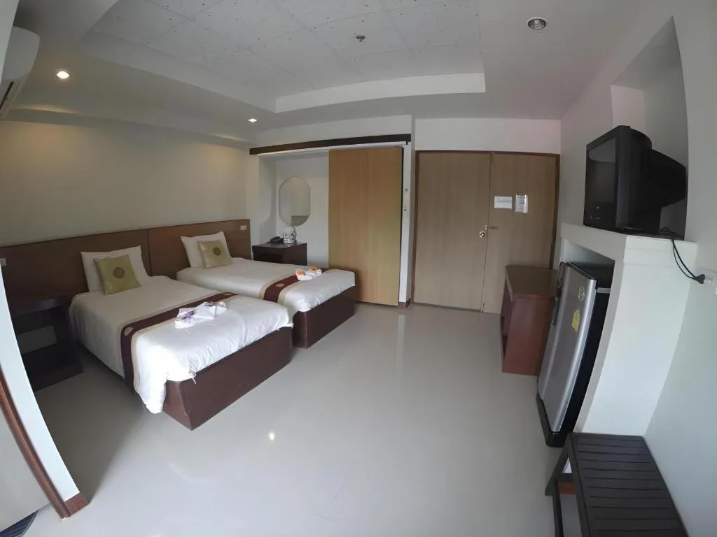 Bed in Century Grand Hotel