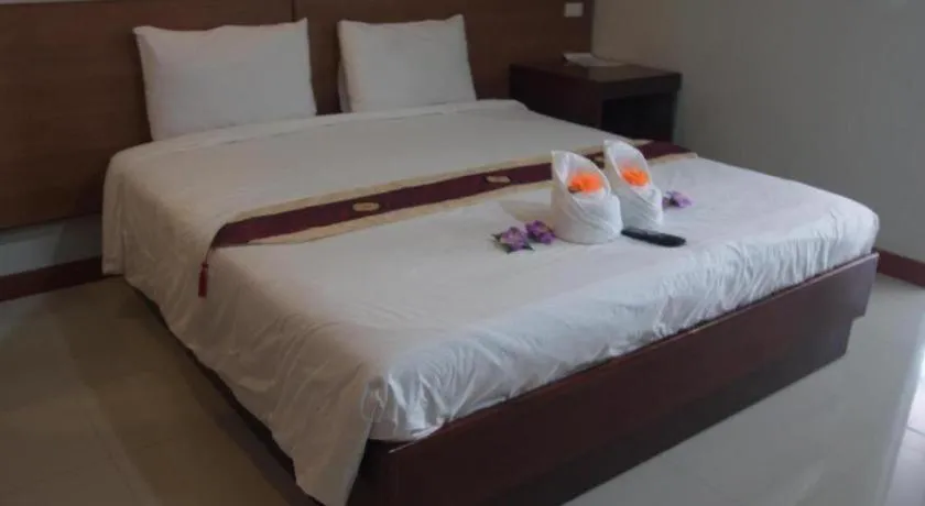 Bed in Century Grand Hotel