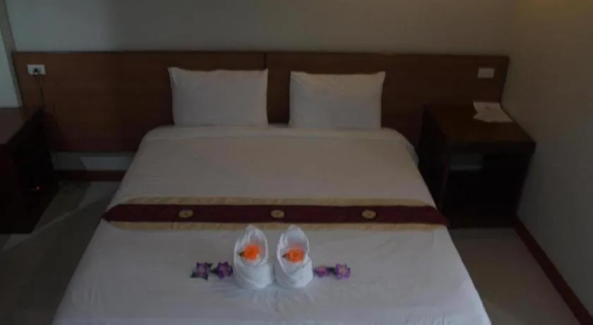 Bed in Century Grand Hotel