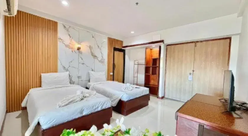 Bed in Century Grand Hotel Bed in Century Grand Hotel