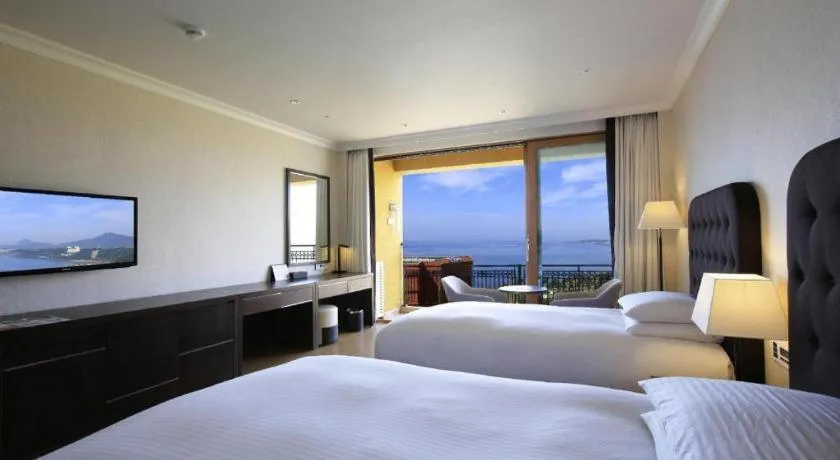 Bed in Jeju Booyoung Hotel