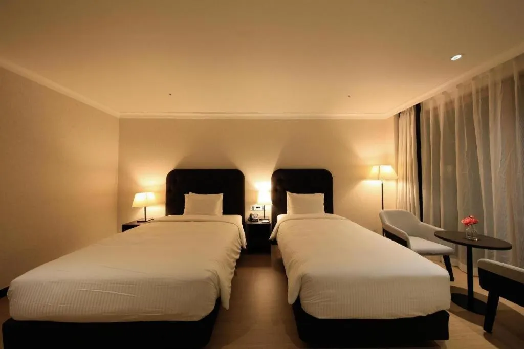 Bed in Jeju Booyoung Hotel