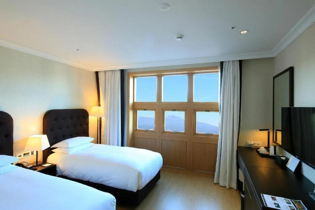Bed in Jeju Booyoung Hotel
