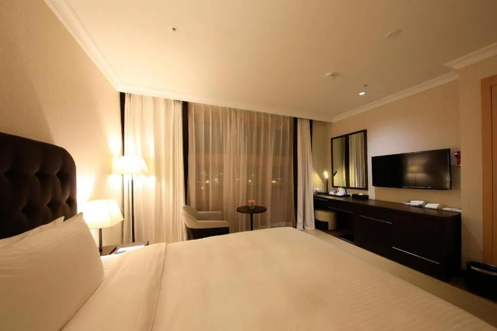 Bed in Jeju Booyoung Hotel