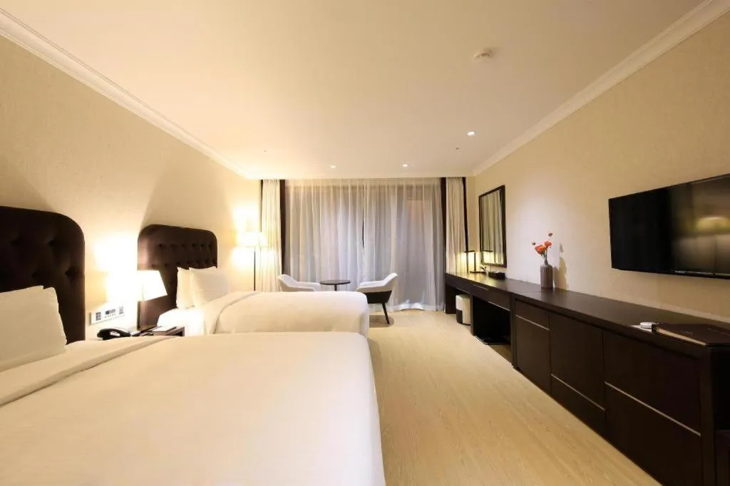 Bed in Jeju Booyoung Hotel