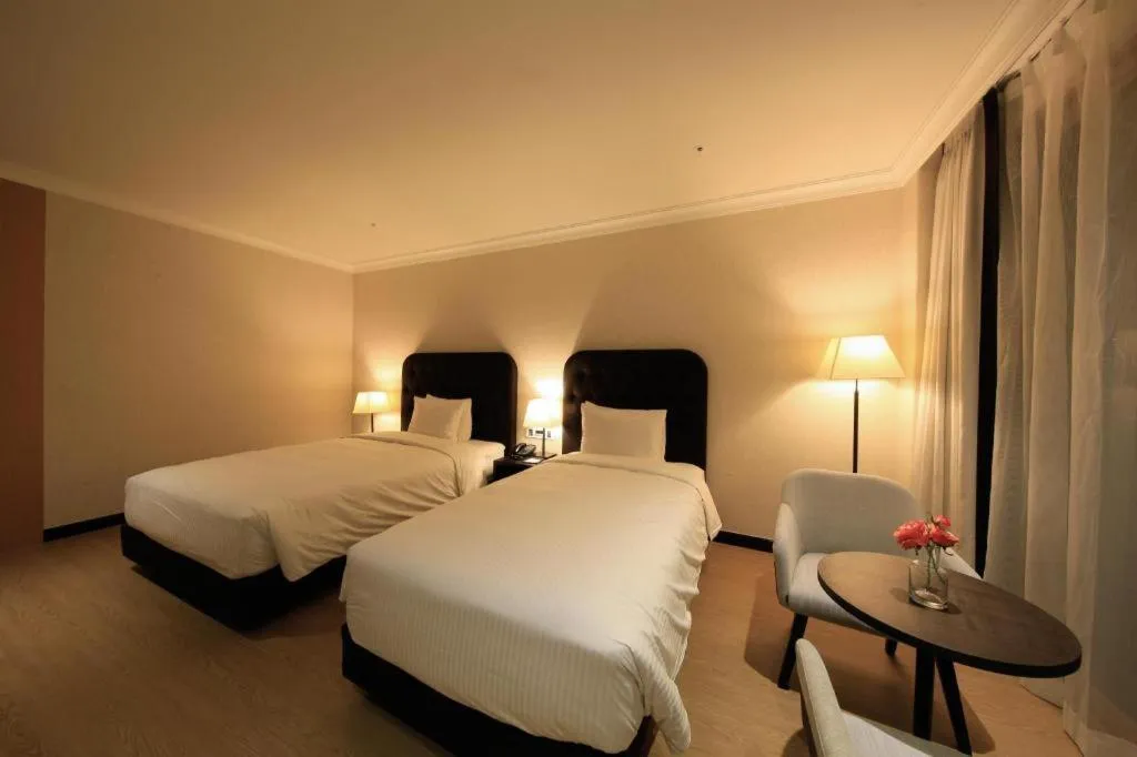 Bed in Jeju Booyoung Hotel