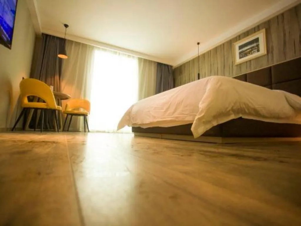 Bed in Qingdao Elegance Hotel