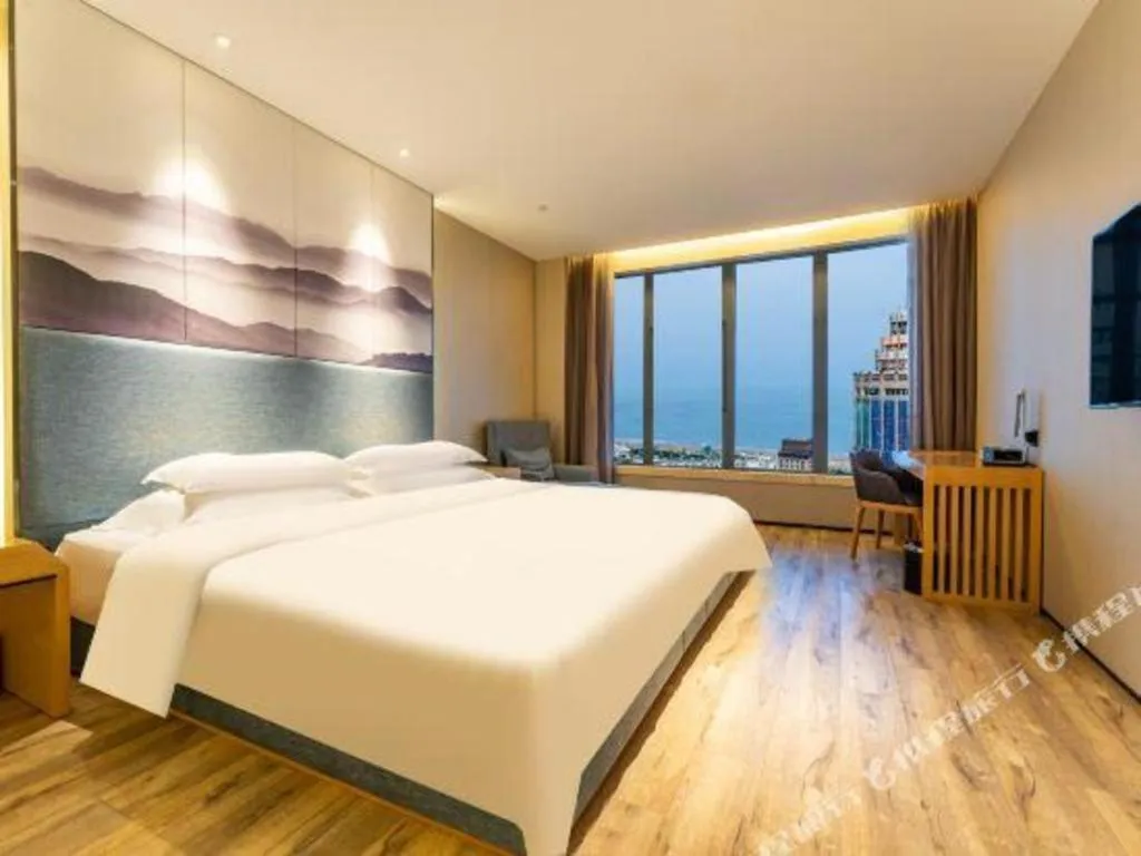 Bed in Qingdao Elegance Hotel