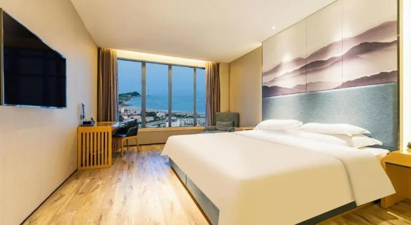 Bed in Qingdao Elegance Hotel