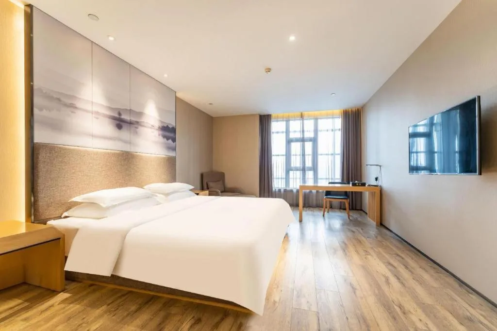 Bed in Qingdao Elegance Hotel