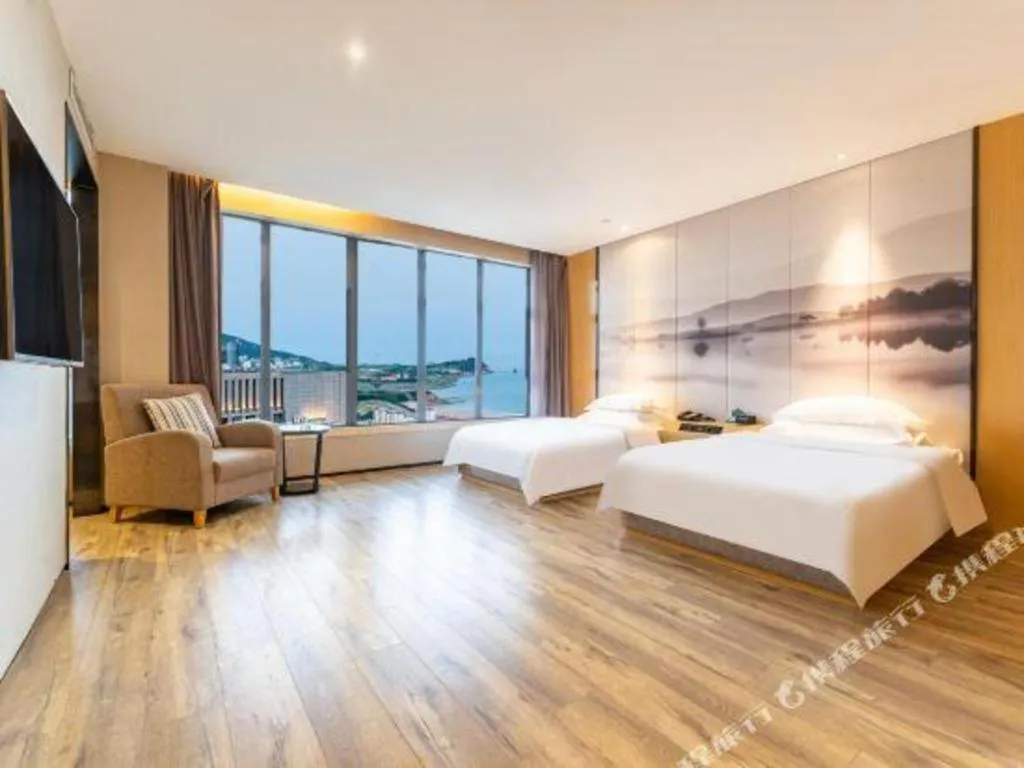 Bed in Qingdao Elegance Hotel