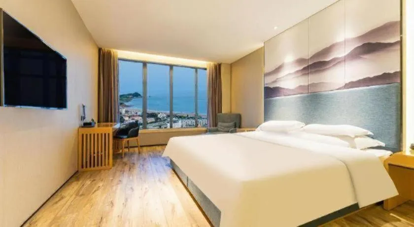 Bed in Qingdao Elegance Hotel