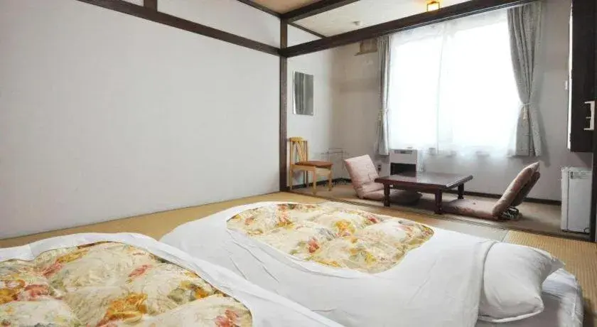 Bed in Yunosawa Onsen Mori no Shiki Bed in Yunosawa Onsen Mori no Shiki