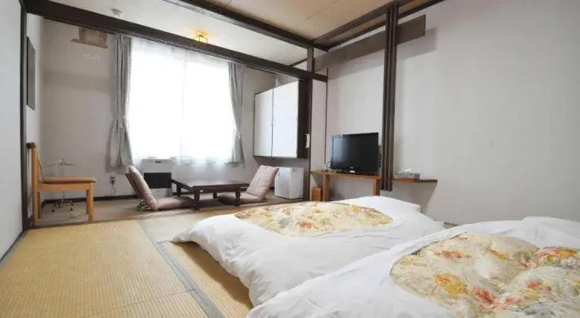 Bed in Yunosawa Onsen Mori no Shiki Bed in Yunosawa Onsen Mori no Shiki