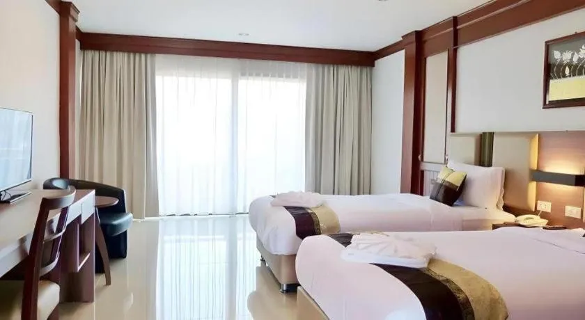 Bed in The Impress Nan Hotel