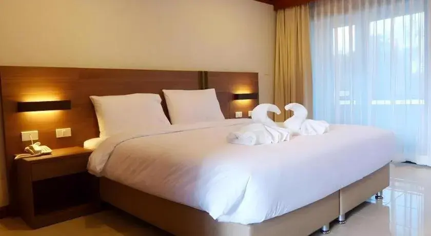 Bed in The Impress Nan Hotel Bed in The Impress Nan Hotel