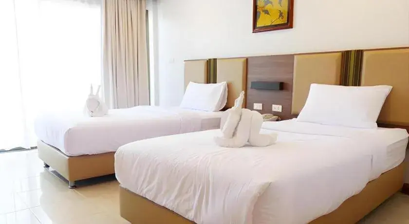 Bed in The Impress Nan Hotel Bed in The Impress Nan Hotel