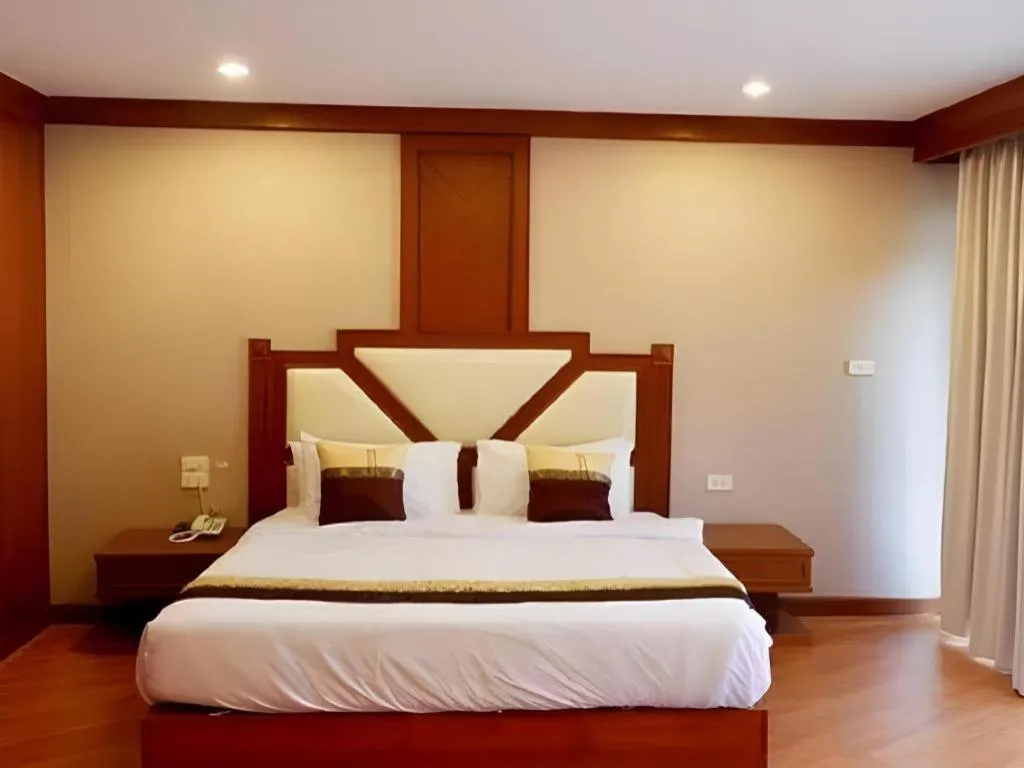 Bed in The Impress Nan Hotel