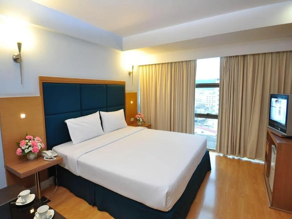 Bed in Mayflower Grande Hotel