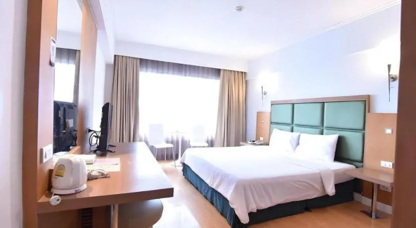 Bed in Mayflower Grande Hotel