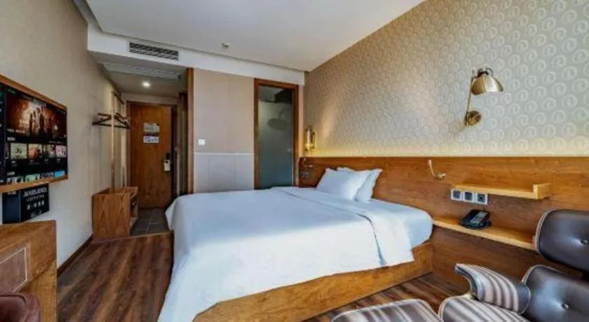 Bed in James Joyce Coffetel Wuxi Taihu Square Subway Station Branch