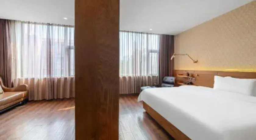 Bed in James Joyce Coffetel Wuxi Taihu Square Subway Station Branch Bed in James Joyce Coffetel Wuxi Taihu Square Subway Station Branch