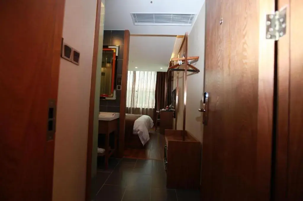 Bed in James Joyce Coffetel Wuxi Taihu Square Subway Station Branch Bed in James Joyce Coffetel Wuxi Taihu Square Subway Station Branch