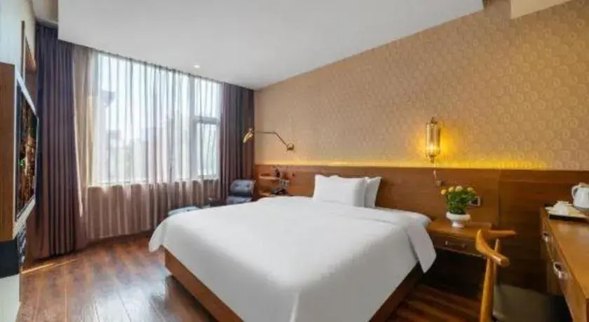 Bed in James Joyce Coffetel Wuxi Taihu Square Subway Station Branch Bed in James Joyce Coffetel Wuxi Taihu Square Subway Station Branch