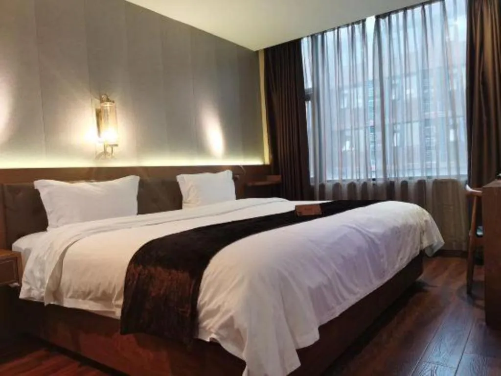 Bed in James Joyce Coffetel Wuxi Taihu Square Subway Station Branch