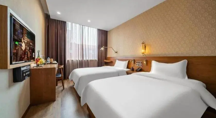 Bed in James Joyce Coffetel Wuxi Taihu Square Subway Station Branch Bed in James Joyce Coffetel Wuxi Taihu Square Subway Station Branch