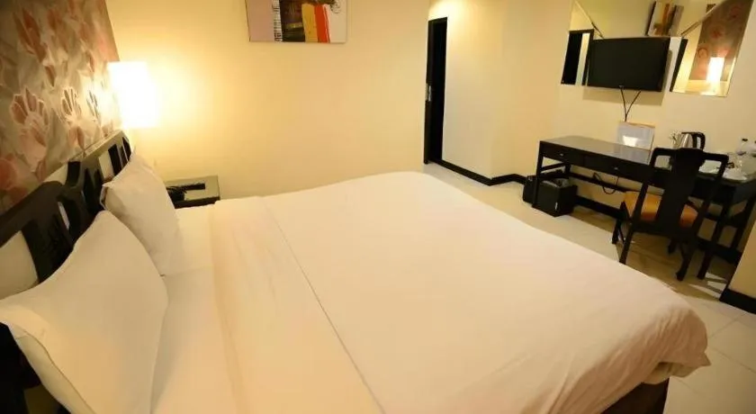 Bed in Grand Hotel Surabaya