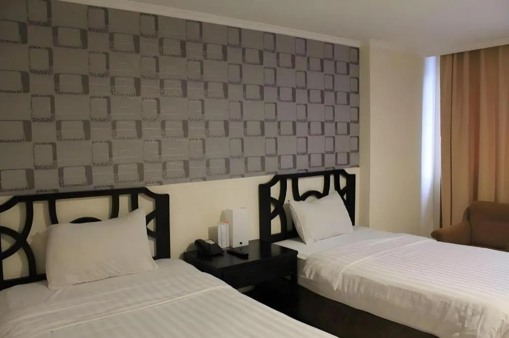 Bed in Grand Hotel Surabaya