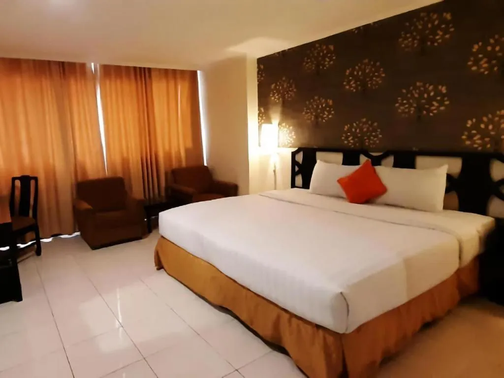 Bed in Grand Hotel Surabaya