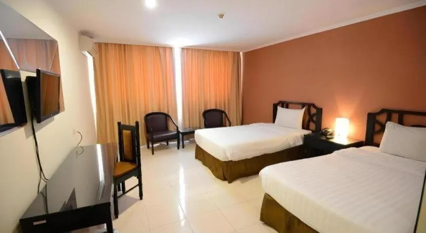 Bed in Grand Hotel Surabaya