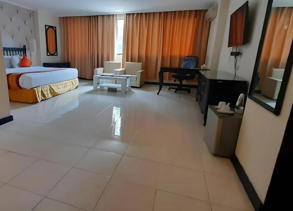 Bed in Grand Hotel Surabaya