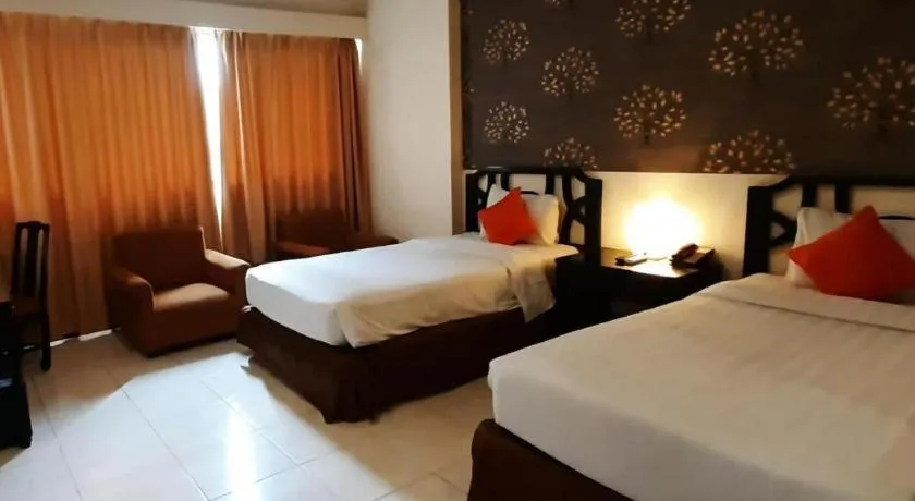 Bed in Grand Hotel Surabaya