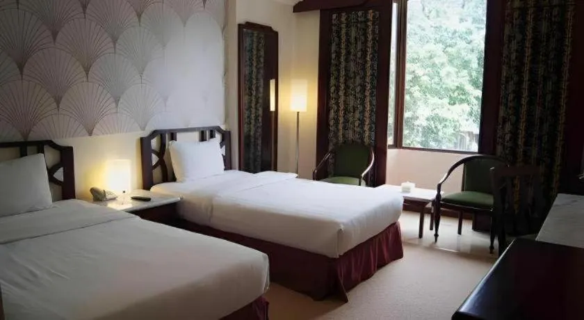 Bed in Grand Hotel Surabaya