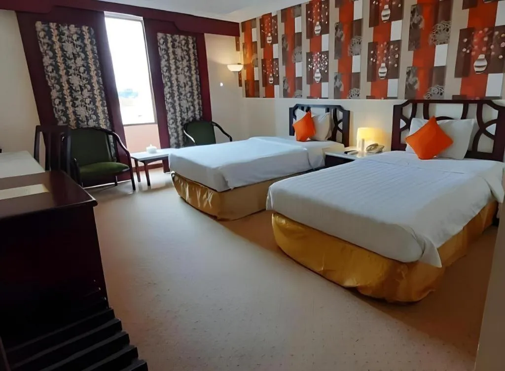 Bed in Grand Hotel Surabaya