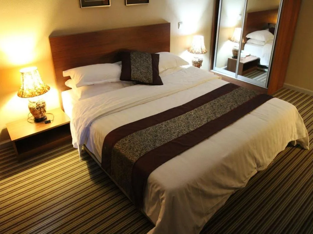 Bed in Pankun Business Hotel