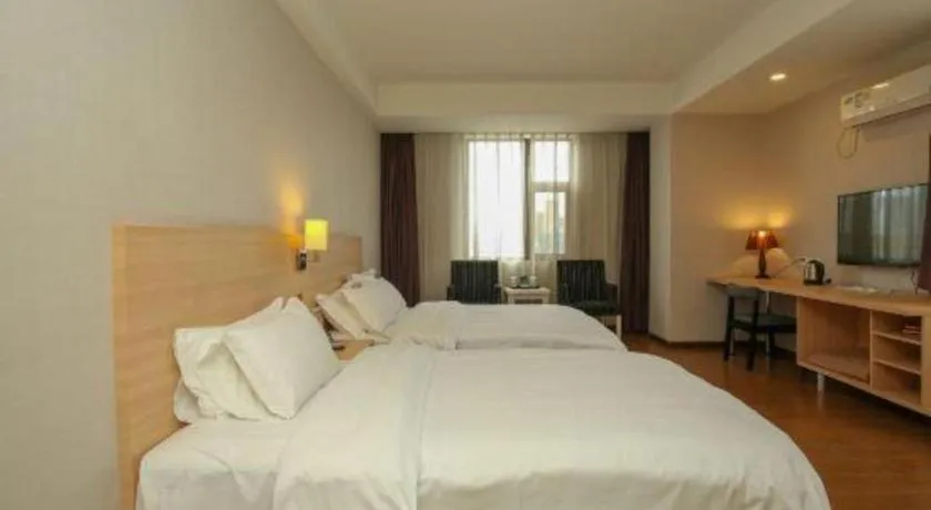 Bed in Pankun Business Hotel