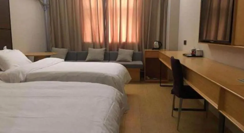 Bed in Pankun Business Hotel
